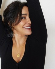 Neha Sharma Seductive Smile in Black Top Picture 01