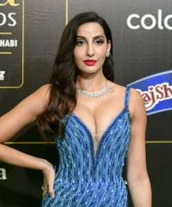 Nora Fatehi Showing Cleavage in a Blue Dress 01