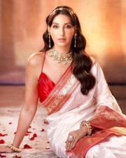 Nora Fatehi in a Red and White Silk Saree Photos 01