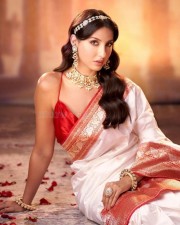 Nora Fatehi in a Red and White Silk Saree Photos 02