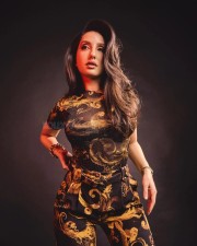 Nora Fatehi in a Versace Yellow Gold Co Ord Set Photos 01