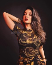 Nora Fatehi in a Versace Yellow Gold Co Ord Set Photos 02