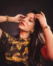 Nora Fatehi in a Versace Yellow Gold Co Ord Set Photos 03