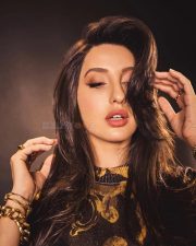 Nora Fatehi in a Versace Yellow Gold Co Ord Set Photos 04