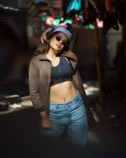O Manchi Ghost Actress Nandita Swetha in a Black Bralette Crop Top with a Light Blue Jeans and Brown Jacket Pictures 01