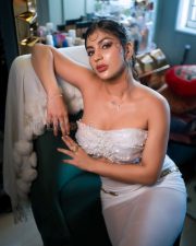 Opulent Actress Yashika Aannand in a White Strapless Pearl Bustier Corset and Teal Trousers Photos 01