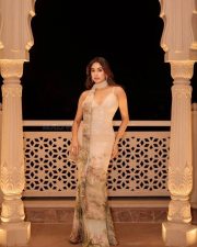 Peddi Actress Janvhi Kapoor in a Beige Sequinned Maxi Dress with Floral Print Photos 05