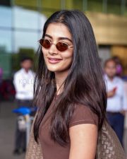 Photogenic Actress Pooja Hegde in a Brown Tee at Airport Photos 01