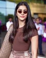 Photogenic Actress Pooja Hegde in a Brown Tee at Airport Photos 03