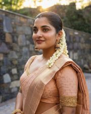 Photogenic Malayalam Actress Nivetha Thomas in a Peach Silk Saree with a Matching Blouse Pictures 03