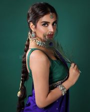 Popular Sexy Beauty Nidhhi Agerwal in a Royal Blue Saree with Golden Floral Embroidered Border and a Green Sleeveless Blouse Pictures 01