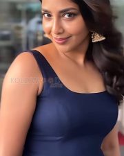 Radiant Actress Aishwarya Lekshmi in a Navy Blue Pleated Dress Photos 01