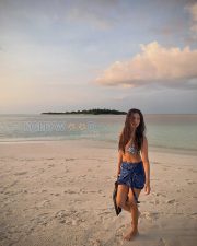 Radiant Actress Malavika Mohanan in a Blue Printed Bikini Sarong Photos 01 Radiant Actress Malavika Mohanan in a Blue Printed Bikini Sarong Photos 01