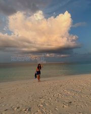 Radiant Actress Malavika Mohanan in a Blue Printed Bikini Sarong Photos 03 Radiant Actress Malavika Mohanan in a Blue Printed Bikini Sarong Photos 03
