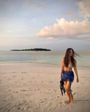 Radiant Actress Malavika Mohanan in a Blue Printed Bikini Sarong Photos 04 Radiant Actress Malavika Mohanan in a Blue Printed Bikini Sarong Photos 04