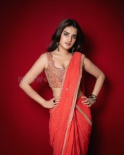 Radiant Actress Nidhhi Agerwal in a Red Orange Georgette Saree Photos 02
