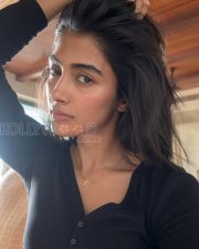 Radiant Actress Pooja Hegde in a Black ribbed henley top Photos 01