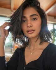 Radiant Actress Pooja Hegde in a Black ribbed henley top Photos 03