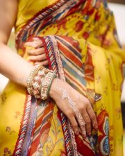 Radiant Actress Tamannaah Bhatia in a Yellow Floral Print Off Shoulder Saree Photos 03