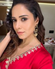 Radiant Nushrratt Bharuccha Cleavage in a White Embroidered Mirror Work Lehenga Blouse Photos 05