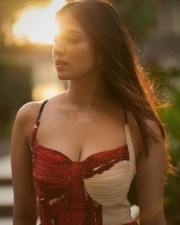 Ravishing Heroine Malavika Mohanan in an Ivory and Red Chiffon Bandhani Printed Maxi Dress Pictures 01
