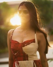 Ravishing Heroine Malavika Mohanan in an Ivory and Red Chiffon Bandhani Printed Maxi Dress Pictures 03