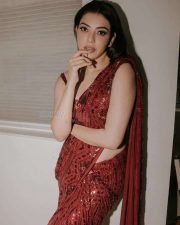 Ravishing Kajal Aggarwal in a Shiny Red Saree Photos 04