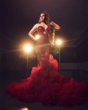 Ravishing Nidhhi Agerwal in a Sequined Red Strapless Gown with Deep Neck Cleavage Photos 05