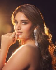 Ravishing Nidhhi Agerwal in a Sequined Red Strapless Gown with Deep Neck Cleavage Photos 06