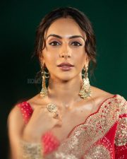Ravishing Rakul Preet Singh in a Royal Red Saree with a Matching Sleeveless Blouse Pictures 01