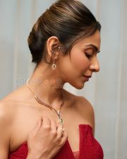 Resplendent Actress Rakul Preet Singh in a Red Strapless Sequined Peplum Dress Photos 01