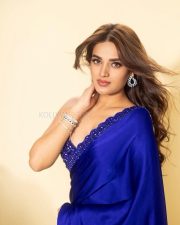 Riveting Actress Nidhhi Agerwal in a Royal Blue Satin Saree With Crystal Blouse Photos 01