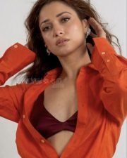 Riveting Actress Tamannaah Bhatia in a Red Open Shirt and Maroon Satin Bralette Photos 03