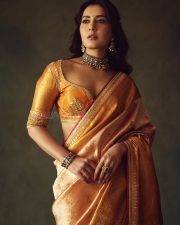 Rowdy and Co Heroine Raashi Khanna in a Gold Kanchipuram Tissue Saree with a Mustard Orange Silk Blouse Pictures 06