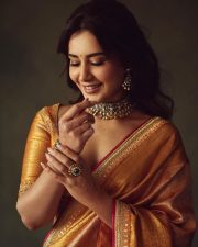 Rowdy and Co Heroine Raashi Khanna in a Gold Kanchipuram Tissue Saree with a Mustard Orange Silk Blouse Pictures 09