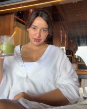 Sanjog Actress Neha Sharma in an Oversized White Shirt over a White Tank Top Bralette Photos 02