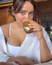 Sanjog Actress Neha Sharma in an Oversized White Shirt over a White Tank Top Bralette Photos 03