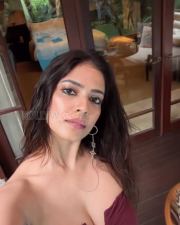 Seductive Malavika Mohanan Cleavage in a Maroon Strapless Mini Dress Photos 02