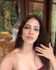 Seductive Malavika Mohanan Cleavage in a Maroon Strapless Mini Dress Photos 04