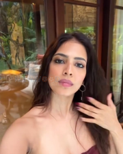 Seductive Malavika Mohanan Cleavage in a Maroon Strapless Mini Dress Photos 04