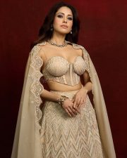 Seductive Nushratt Bharucha Cleavage in a Gold Embroidered Lehenga with Cape Photos 01