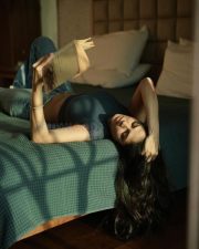 Sensual Malavika Mohanan in a Black Turtle Neck Top with Classic Blue Denim Lying on the Bed Photos 09 Sensual Malavika Mohanan in a Black Turtle Neck Top with Classic Blue Denim Lying on the Bed Photos 09