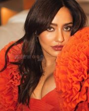 Sensual Neha Sharma in an Orange Floor Length Gown with a Bold Cleavage Cut Out Photos 04