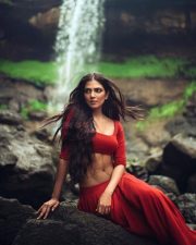 Sensuous Malavika Mohanan in a Bold Red Blouse with Matching Red Skirt Standing in Front of a Waterfall Photoshoot Pictures 03 Sensuous Malavika Mohanan in a Bold Red Blouse with Matching Red Skirt Standing in Front of a Waterfall Photoshoot Pictures 03