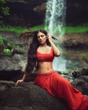Sensuous Malavika Mohanan in a Bold Red Blouse with Matching Red Skirt Standing in Front of a Waterfall Photoshoot Pictures 04 Sensuous Malavika Mohanan in a Bold Red Blouse with Matching Red Skirt Standing in Front of a Waterfall Photoshoot Pictures 04