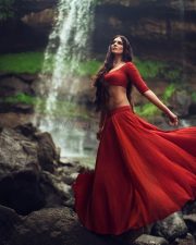 Sensuous Malavika Mohanan in a Bold Red Blouse with Matching Red Skirt Standing in Front of a Waterfall Photoshoot Pictures 05 Sensuous Malavika Mohanan in a Bold Red Blouse with Matching Red Skirt Standing in Front of a Waterfall Photoshoot Pictures 05