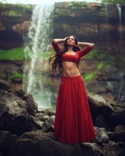 Sensuous Malavika Mohanan in a Bold Red Blouse with Matching Red Skirt Standing in Front of a Waterfall Photoshoot Pictures 06 Sensuous Malavika Mohanan in a Bold Red Blouse with Matching Red Skirt Standing in Front of a Waterfall Photoshoot Pictures 06