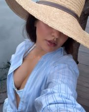 Sensuous Neha Sharma Boobs Cleavage in a Light Blue and White Striped Bikini Top and Button Down Shirt Photos 01