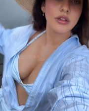 Sensuous Neha Sharma Boobs Cleavage in a Light Blue and White Striped Bikini Top and Button Down Shirt Photos 02