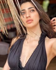 Sexy Actress Raai Laxmi in a Bohemian Style Black Halter Neck Plunging V Neckline Dress Photos 03